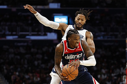 Oct 28, 2023; Washington, District of Columbia, USA; Washington Wizards guard Delon Wright (55) steals a pass intended for Memphis Grizzlies guard Derrick Rose (23) in the fourth quarter at Capital One Arena. Mandatory Credit: Geoff Burke-USA TODAY Sports