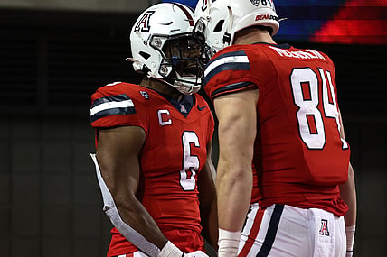 Oct 28, 2023; Tucson, Arizona, USA; Arizona Wildcats running back Michael Wiley #6 celebrates a touchdown with tight end Tanner McLachlan #84 during the second half at Arizona Stadium. Mandatory Credit: Zachary BonDurant-USA TODAY Sports