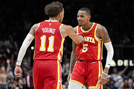 Oct 30, 2023; Atlanta, Georgia, USA; Atlanta Hawks guards Trae Young (11) and Dejounte Murray (5) react after a basket against the Minnesota Timberwolves during the second half at State Farm Arena. Mandatory Credit: Dale Zanine-USA TODAY Sports