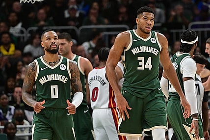 Oct 30, 2023; Milwaukee, Wisconsin, USA; Milwaukee Bucks forward Giannis Antetokounmpo (34) and guard Damian Lillard (0) looks on during a timeout in the fourth quarter against the Miami Heat at Fiserv Forum. Mandatory Credit: Benny Sieu-USA TODAY Sports