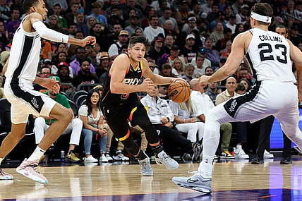 Oct 31, 2023; Phoenix, Arizona, USA; Phoenix Suns guard Grayson Allen #8 drives to the net agaisnt San Antonio Spurs center Victor Wembanyama #1 and forward Jeremy Sochan #10 during the second quarter at Footprint Center. Mandatory Credit: Zachary BonDurant-USA TODAY Sports