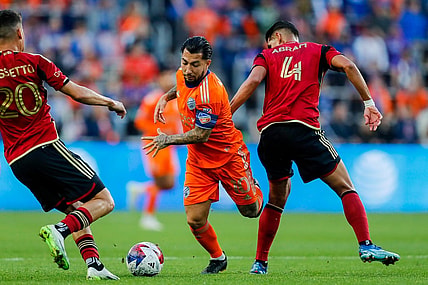 Oct 21, 2023; Cincinnati, Ohio, USA; FC Cincinnati midfielder Luciano Acosta (10) battles for the ball against Atlanta United FC midfielder Matheus Rossetto (20) and defender Luis Abram (4) in the first half at TQL Stadium. Mandatory Credit: Katie Stratman-USA TODAY Sports