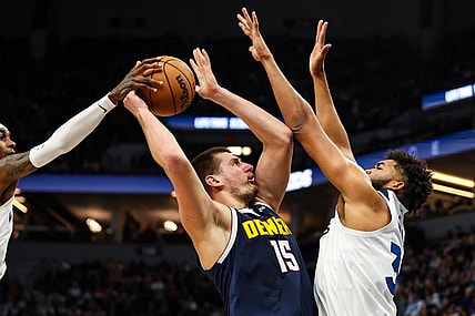 Nov 1, 2023; Minneapolis, Minnesota, USA; Minnesota Timberwolves forward Jaden McDaniels (3) blocks a shot by Denver Nuggets center Nikola Jokic (15) during the first half at Target Center. Mandatory Credit: Matt Krohn-USA TODAY Sports