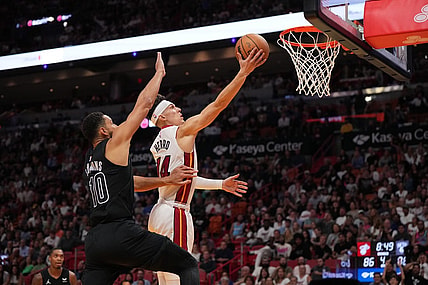 Nov 1, 2023; Miami, Florida, USA; Miami Heat guard Tyler Herro (14) shoots the ball around Brooklyn Nets guard Ben Simmons (10) during the second half at Kaseya Center. Mandatory Credit: Jasen Vinlove-USA TODAY Sports
