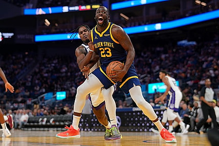 Nov 1, 2023; San Francisco, California, USA; Golden State Warriors forward Draymond Green (23) is fouled by Sacramento Kings guard Davion Mitchell (15) in the third quarter at the Chase Center. Mandatory Credit: Cary Edmondson-USA TODAY Sports