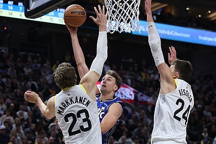 Nov 2, 2023; Salt Lake City, Utah, USA; Orlando Magic forward Franz Wagner (22) goes to the basket against Utah Jazz forward LauriMarkkanen (23) and center Walker Kessler (24) in the second quarter at the Delta Center. Mandatory Credit: Rob Gray-USA TODAY Sports