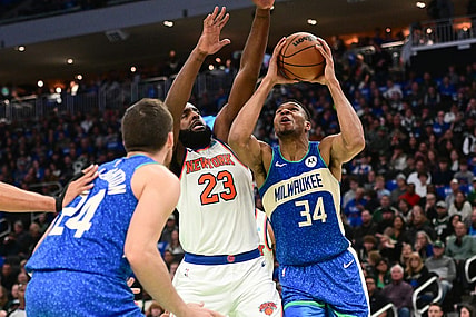 Nov 3, 2023; Milwaukee, Wisconsin, USA; Milwaukee Bucks forward Giannis Antetokounmpo (34) takes a shot against New York Knicks center Mitchell Robinson (23) in the second quarter at Fiserv Forum. Mandatory Credit: Benny Sieu-USA TODAY Sports