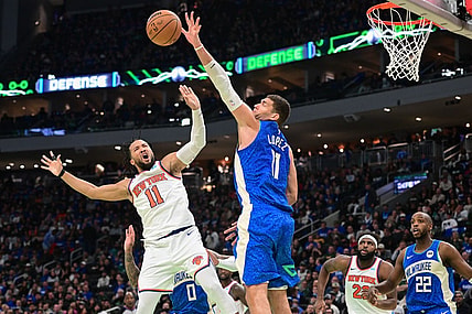 Nov 3, 2023; Milwaukee, Wisconsin, USA; New York Knicks guard Jalen Brunson (11) takes a shot against Milwaukee Bucks center Brook Lopez (11) in the fourth quarter at Fiserv Forum. Mandatory Credit: Benny Sieu-USA TODAY Sports