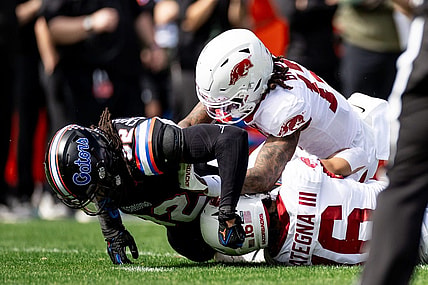 Florida Gators safety Cahron Rackley (32) tackles Arkansas Razorbacks wide receiver Isaiah Sategna (16) during a kickoff during the first half at Steve Spurrier Field at Ben Hill Griffin Stadium in Gainesville, FL on Saturday, November 4, 2023. [Matt Pendleton/Gainesville Sun]