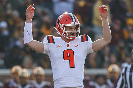 Nov 4, 2023; Minneapolis, Minnesota, USA; Illinois Fighting Illini quarterback Luke Altmyer (9) celebrates his touchdown pass to wide receiver Isaiah Williams (1) during the first half against the Minnesota Golden Gophers at Huntington Bank Stadium. Mandatory Credit: Matt Krohn-USA TODAY Sports