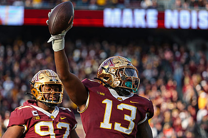 Nov 4, 2023; Minneapolis, Minnesota, USA; Minnesota Golden Gophers defensive lineman Chris Collins (13) celebrates after recovering a fumble against the Illinois Fighting Illini during the second half at Huntington Bank Stadium. Mandatory Credit: Matt Krohn-USA TODAY Sports