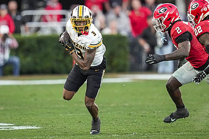 Nov 4, 2023; Athens, Georgia, USA; Missouri Tigers wide receiver Luther Burden III (3) runs against Georgia Bulldogs linebacker Smael Mondon Jr. (2) and defensive back Javon Bullard (22) during the second half at Sanford Stadium. Mandatory Credit: Dale Zanine-USA TODAY Sports