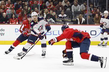 Nov 4, 2023; Washington, District of Columbia, USA; Columbus Blue Jackets center Jack Roslovic (96) skates with the puck as Washington Capitals right wing Anthony Mantha (39) and Capitals center Connor McMichael (24) defend in the first period at Capital One Arena. Mandatory Credit: Geoff Burke-USA TODAY Sports