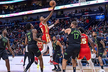 Nov 4, 2023; New Orleans, Louisiana, USA;  Atlanta Hawks guard Dejounte Murray (5) drives to the basket against New Orleans Pelicans forward Herbert Jones (5) during the first half at Smoothie King Center. Mandatory Credit: Stephen Lew-USA TODAY Sports