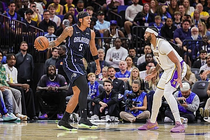 Nov 4, 2023; Orlando, Florida, USA; Orlando Magic forward Paolo Banchero (5) looks to pass against Los Angeles Lakers forward Anthony Davis (3) during the first quarter at Amway Center. Mandatory Credit: Mike Watters-USA TODAY Sports