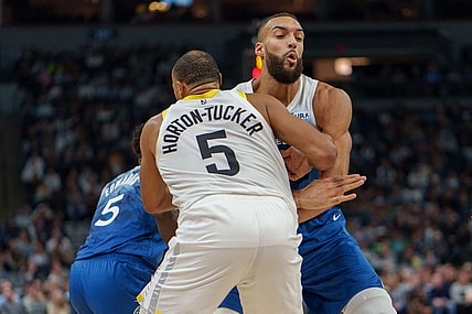 Nov 4, 2023; Minneapolis, Minnesota, USA; Minnesota Timberwolves center Rudy Gobert (27) sets a screen on Utah Jazz guard Talen Horton-Tucker (5) in the second quarter at Target Center. Mandatory Credit: Matt Blewett-USA TODAY Sports