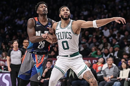 Nov 4, 2023; Brooklyn, New York, USA;  Brooklyn Nets forward Dorian Finney-Smith (28) and Boston Celtics forward Jayson Tatum (0) box out for a rebound in the fourth quarter at Barclays Center. Mandatory Credit: Wendell Cruz-USA TODAY Sports