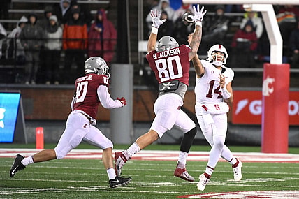 Nov 4, 2023; Pullman, Washington, USA; Stanford Cardinal quarterback Ashton Daniels (14) throws a pass against Washington State Cougars defensive end Brennan Jackson (80) in the first half at Gesa Field at Martin Stadium. Mandatory Credit: James Snook-USA TODAY Sports