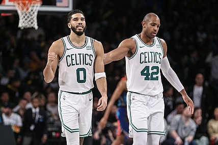 Nov 4, 2023; Brooklyn, New York, USA;  Boston Celtics forward Jayson Tatum (0) and center Al Horford (42) walk back to the bench after the Brooklyn Nets call a time out in the fourth quarter at Barclays Center. Mandatory Credit: Wendell Cruz-USA TODAY Sports