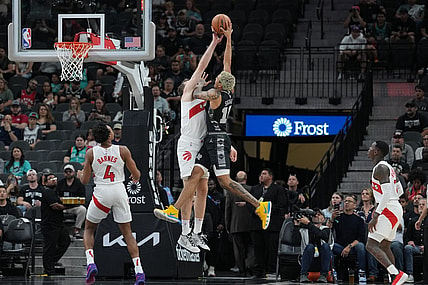 Nov 5, 2023; San Antonio, Texas, USA;  Toronto Raptors center Jakob Poeltl (19) blocks a shot by San Antonio Spurs forward Jeremy Sochan (10) in the first half at the Frost Bank Center. Mandatory Credit: Daniel Dunn-USA TODAY Sports