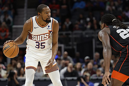 Nov 5, 2023; Detroit, Michigan, USA;  Phoenix Suns forward Kevin Durant (35) dribbles defended by Detroit Pistons center Isaiah Stewart (28) in the first half at Little Caesars Arena. Mandatory Credit: Rick Osentoski-USA TODAY Sports