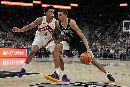 Nov 5, 2023; San Antonio, Texas, USA;  San Antonio Spurs center Victor Wembanyama (1) dribbles against Toronto Raptors forward Scottie Barnes (4) in the second half at the Frost Bank Center. Mandatory Credit: Daniel Dunn-USA TODAY Sports
