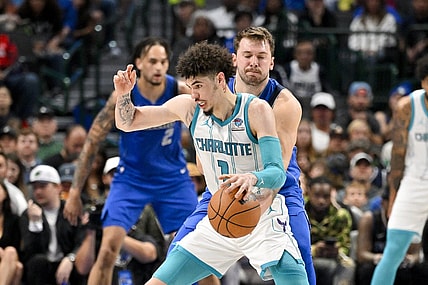 Nov 5, 2023; Dallas, Texas, USA; Dallas Mavericks guard Luka Doncic (77) attempts to knock the ball away from Charlotte Hornets guard LaMelo Ball (1) during the second quarter at the American Airlines Center. Mandatory Credit: Jerome Miron-USA TODAY Sports