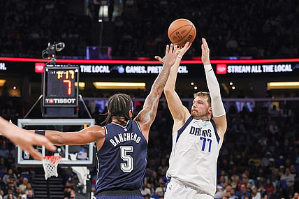 Nov 6, 2023; Orlando, Florida, USA; Dallas Mavericks guard Luka Doncic (77) shoots the ball against Orlando Magic forward Paolo Banchero (5) during the second quarter at Amway Center. Mandatory Credit: Mike Watters-USA TODAY Sports