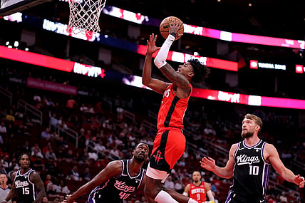 Nov 6, 2023; Houston, Texas, USA; Houston Rockets guard Jalen Green (4) makes a layup against the Sacramento Kings during the first quarter at Toyota Center. Mandatory Credit: Erik Williams-USA TODAY Sports