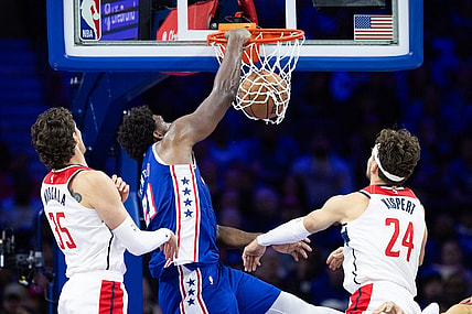 Nov 6, 2023; Philadelphia, Pennsylvania, USA; Philadelphia 76ers center Joel Embiid (21) dunks the ball past Washington Wizards center Mike Muscala (35) and forward Corey Kispert (24) during the third quarter at Wells Fargo Center. Mandatory Credit: Bill Streicher-USA TODAY Sports