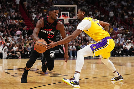 Nov 6, 2023; Miami, Florida, USA; Miami Heat forward Jimmy Butler (22) drives the ball around Los Angeles Lakers forward Cam Reddish (5) during the first half at Kaseya Center. Mandatory Credit: Jasen Vinlove-USA TODAY Sports