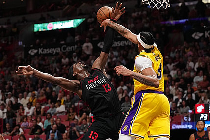 Nov 6, 2023; Miami, Florida, USA; Los Angeles Lakers forward Anthony Davis (3) fouls Miami Heat center Bam Adebayo (13) during the first half at Kaseya Center. Mandatory Credit: Jasen Vinlove-USA TODAY Sports
