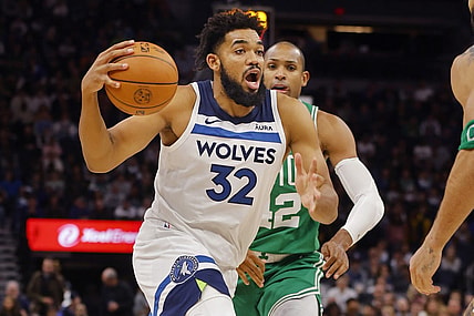 Nov 6, 2023; Minneapolis, Minnesota, USA; Minnesota Timberwolves forward Karl-Anthony Towns (32) drives to the basket past Boston Celtics center Al Horford (42) in the fourth quarter at Target Center. Mandatory Credit: Bruce Kluckhohn-USA TODAY Sports