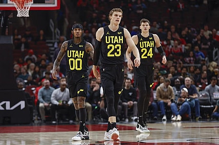 Nov 6, 2023; Chicago, Illinois, USA; Utah Jazz forward Lauri Markkanen (23), Utah Jazz guard Jordan Clarkson (00) and Utah Jazz center Walker Kessler (24) walk on the court during the first half of a basketball game against the Chicago Bulls at United Center. Mandatory Credit: Kamil Krzaczynski-USA TODAY Sports