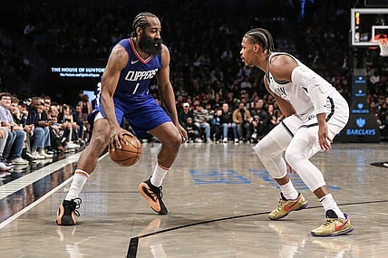 Nov 8, 2023; Brooklyn, New York, USA;  LA Clippers guard James Harden (1) looks to drive past Brooklyn Nets guard Lonnie Walker IV (8) in the third quarter at Barclays Center. Mandatory Credit: Wendell Cruz-USA TODAY Sports