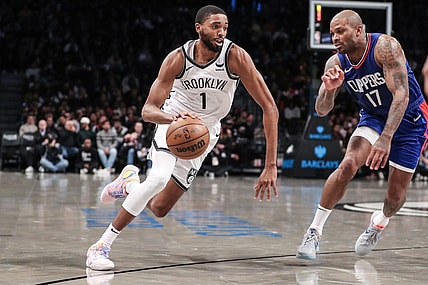 Nov 8, 2023; Brooklyn, New York, USA;  Brooklyn Nets forward Mikal Bridges (1) looks to drive past LA Clippers forward P.J. Tucker (17) in the second quarter at Barclays Center. Mandatory Credit: Wendell Cruz-USA TODAY Sports