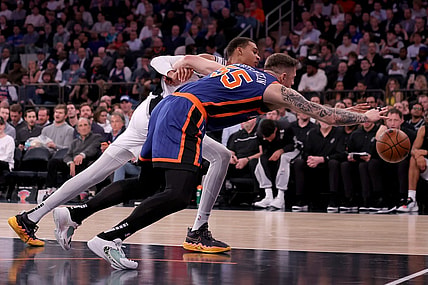 Nov 8, 2023; New York, New York, USA; San Antonio Spurs center Victor Wembanyama (1) and New York Knicks center Isaiah Hartenstein (55) fight for a loose ball during the second quarter at Madison Square Garden. Mandatory Credit: Brad Penner-USA TODAY Sports