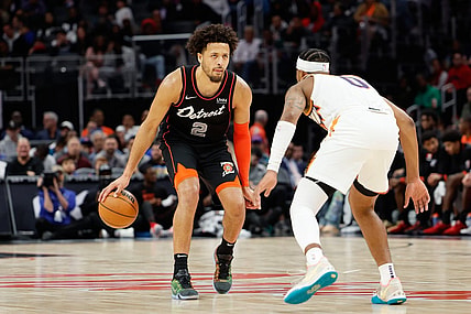 Nov 5, 2023; Detroit, Michigan, USA;  Detroit Pistons guard Cade Cunningham (2) dribbles defended by Phoenix Suns guard Jordan Goodwin (0) at Little Caesars Arena. Mandatory Credit: Rick Osentoski-USA TODAY Sports