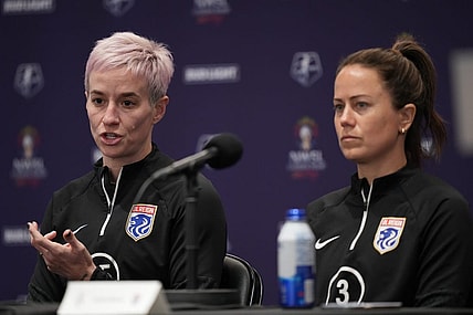 Nov 10, 2023; San Diego, California, USA; OL Reign forward Megan Rapinoe (15) speaks alongside defender Lauren Barnes (3) during a press conference at Snapdragon Stadium. Mandatory Credit: Kyle Terada-USA TODAY Sports