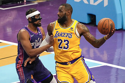 Nov 10, 2023; Phoenix, Arizona, USA; Los Angeles Lakers forward LeBron James (23) drives against Phoenix Suns guard Jordan Goodwin (0) in the first half at Footprint Center. Mandatory Credit: Rick Scuteri-USA TODAY Sports