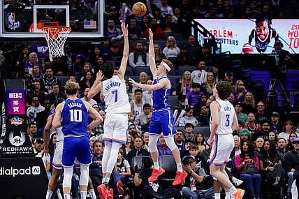 Nov 10, 2023; Sacramento, California, USA; Sacramento Kings guard Kevin Huerter (9) shoots the ball over Oklahoma City Thunder forward Chet Holmgren (7) during the second quarter at Golden 1 Center. Mandatory Credit: Sergio Estrada-USA TODAY Sports