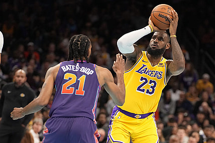 Nov 10, 2023; Phoenix, Arizona, USA; Los Angeles Lakers forward LeBron James (23) shoots against Phoenix Suns forward Keita Bates-Diop (21) in the first half at Footprint Center. Mandatory Credit: Rick Scuteri-USA TODAY Sports