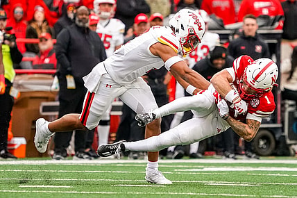 Nov 11, 2023; Lincoln, Nebraska, USA; Nebraska Cornhuskers wide receiver Billy Kemp IV (1) is brought down by Maryland Terrapins defensive back Beau Brade (2) during the second quarter at Memorial Stadium. Mandatory Credit: Dylan Widger-USA TODAY Sports