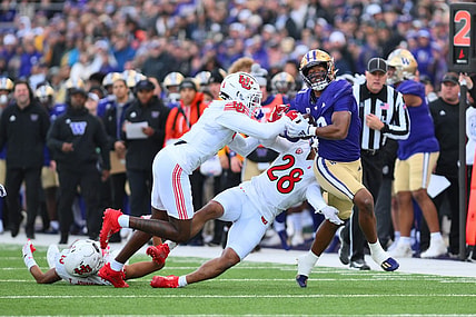 Nov 11, 2023; Seattle, Washington, USA; Washington Huskies running back Dillon Johnson (7) carries the ball after a catch against the Utah Utes during the first half at Alaska Airlines Field at Husky Stadium. Mandatory Credit: Steven Bisig-USA TODAY Sports