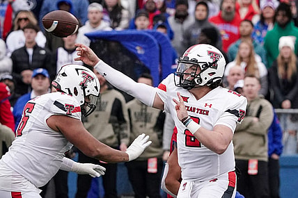 Nov 11, 2023; Lawrence, Kansas, USA; Texas Tech Red Raiders quarterback Behren Morton (2) throws a pass against the Kansas Jayhawks during the second half at David Booth Kansas Memorial Stadium. Mandatory Credit: Denny Medley-USA TODAY Sports