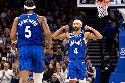 Nov 11, 2023; Orlando, Florida, USA; Orlando Magic guard Jalen Suggs (4) gestures towards Orlando Magic forward Paolo Banchero (5) during the first half against the Milwaukee Bucks at Amway Center. Mandatory Credit: Matt Pendleton-USA TODAY Sports