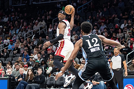 Nov 11, 2023; Atlanta, Georgia, USA; Miami Heat center Bam Adebayo (13) saves the ball from going out of bounds against Atlanta Hawks forward De'Andre Hunter (12) during the first quarter at State Farm Arena. Mandatory Credit: Jordan Godfree-USA TODAY Sports