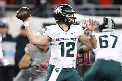 Nov 11, 2023; Columbus, Ohio, USA; Michigan State Spartans quarterback Katin Houser (12) drops back to throw during the first quarter against the Ohio State Buckeyes at Ohio Stadium. Mandatory Credit: Joseph Maiorana-USA TODAY Sports