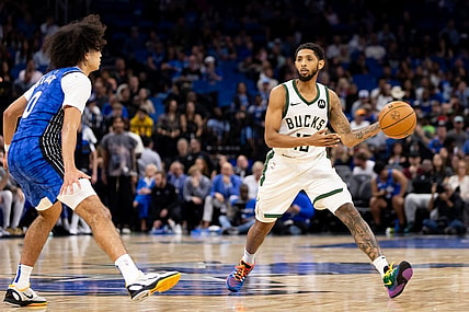Nov 11, 2023; Orlando, Florida, USA; Milwaukee Bucks guard Cameron Payne (15) passes the ball past Orlando Magic guard Anthony Black (0) during the second half at Amway Center. Mandatory Credit: Matt Pendleton-USA TODAY Sports