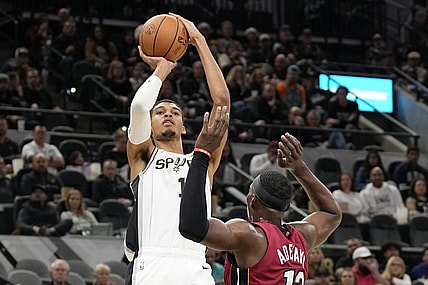 Nov 12, 2023; San Antonio, Texas, USA; San Antonio Spurs center Victor Wembanyama (1) shoots over Miami Heat center Bam Adebayo (13) during the first half at Frost Bank Center. Mandatory Credit: Scott Wachter-USA TODAY Sports